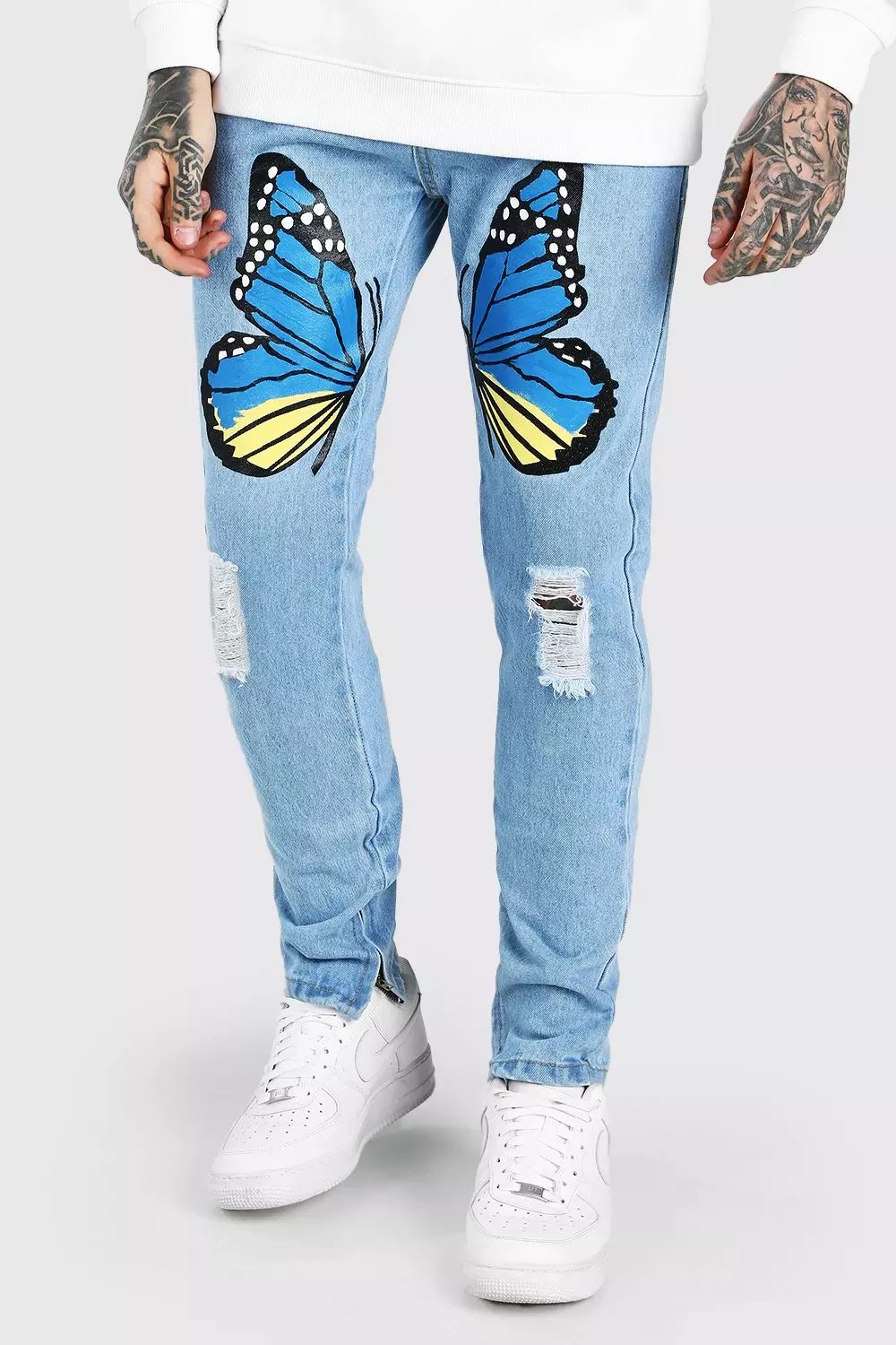 Jeans stretch coupe skinny avec imprim papillon boohooMAN FR